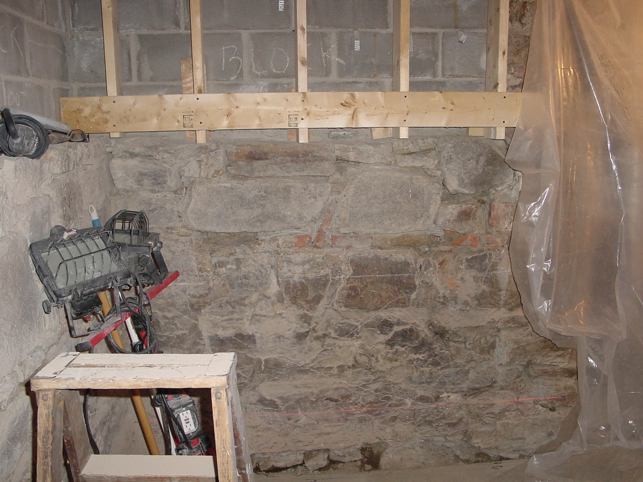 Installing wood bracing for upper cabinets in kitchen