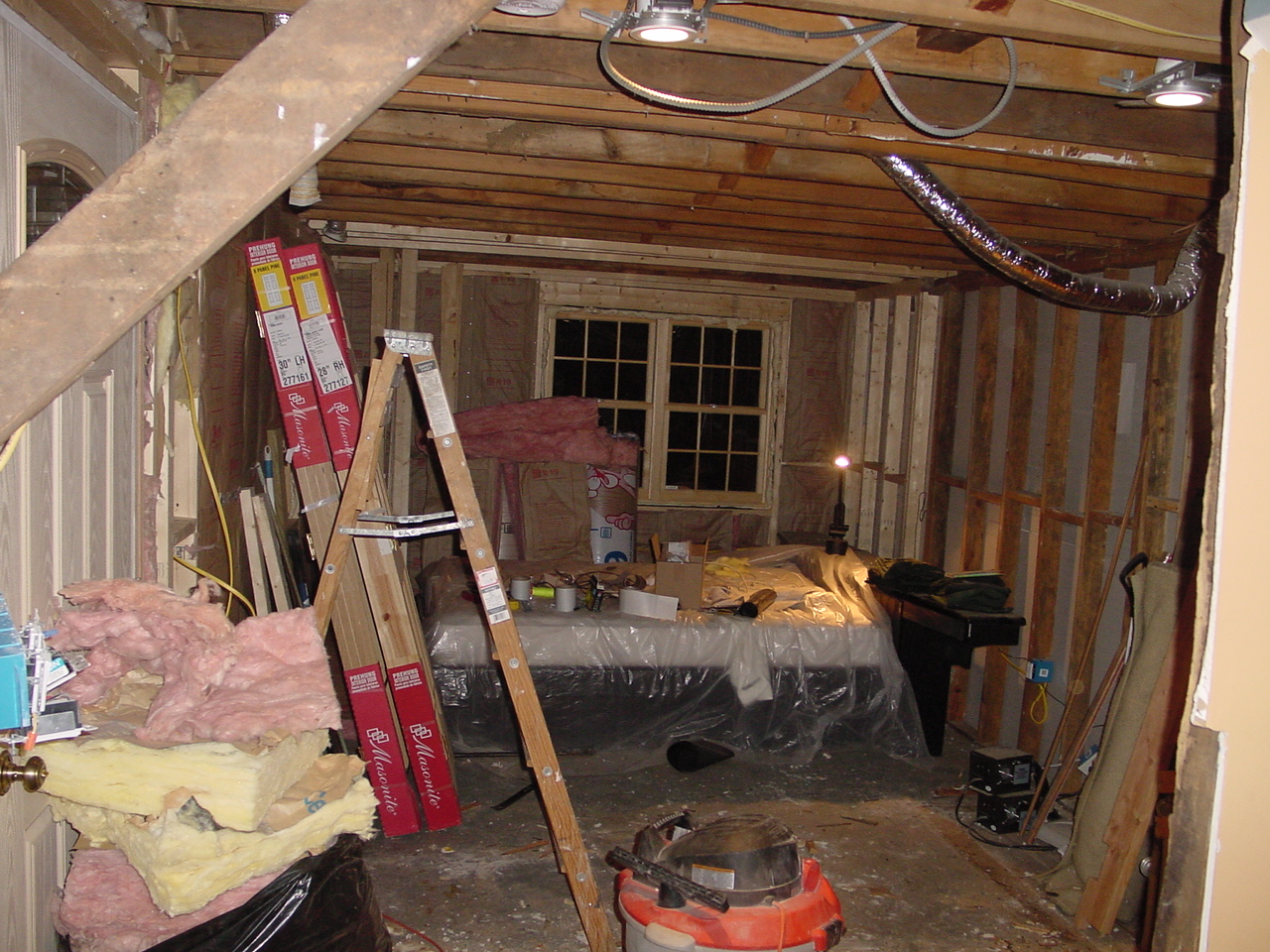 Guest bedroom with new front door in hallway