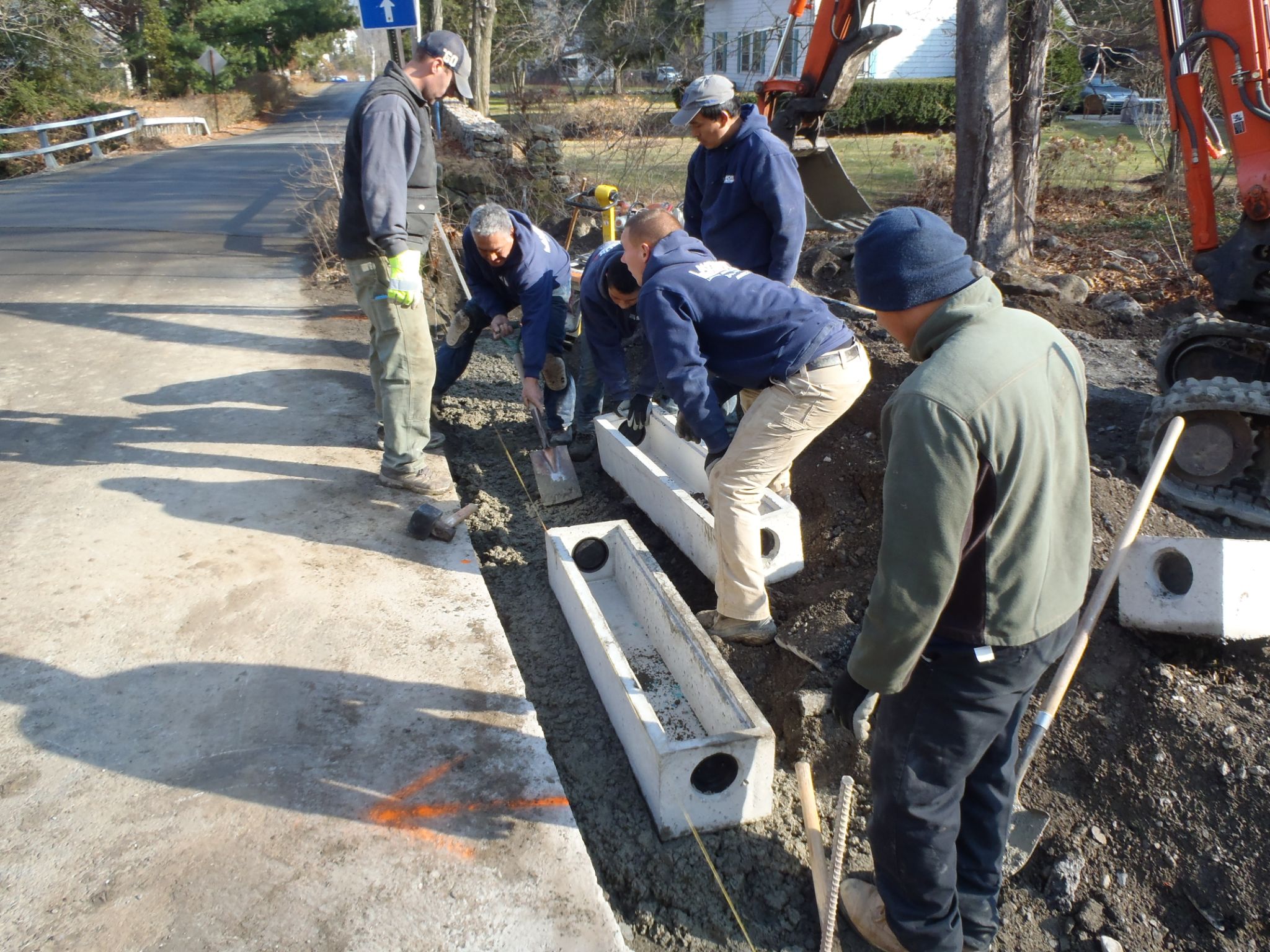 Putting in the cement street drains